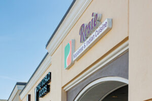 Exterior of Rosie Nepalese and Indian Cuisine in Pittsford Plaza, Rochester NY with signage