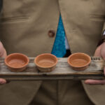 A server holds a tray of mezcal shots at Bitter Honey Mexican restaurant and bar in the Rochester Public Market NY