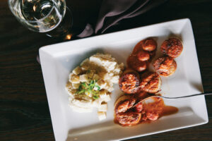 A deconstructed Bloody Mary served with scallops, tomato vodka sauce and celery root puree at Bad Apples Bistro in Spencerport NY