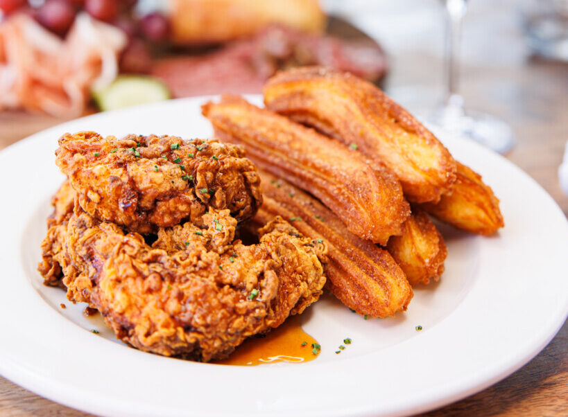 A plate of chicken fried steak and churros at Crisp restaurant in Rochester NY