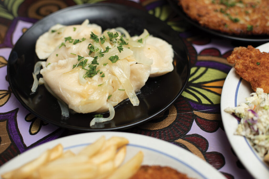 Close-up of a dish of pierogi with sauteed onion at Polska Chata restaurant in Rochester NY