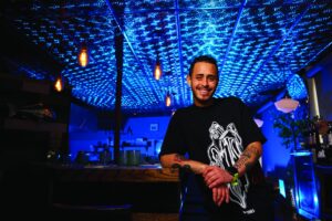 Executive chef Cruz Nieves poses at the bar inside Rella oyster bar in Rochester NY