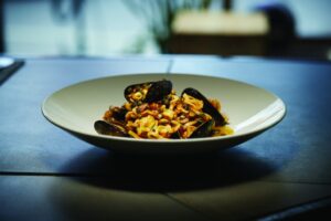 A bowl of Mussels Puttanesca Annelini at Rella Oyster Bar seafood restaurant in Rochester NY