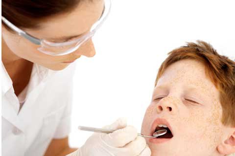 child with dentist