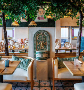 A a small golden water feature stands out in the redesigned Chortke Grill restaurant at the Village Gate in Rochester NY