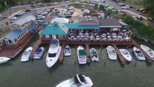 Aerial view of Pelican's Nest Restaurant on the Genesee River in Rochester NY with boats at the dock