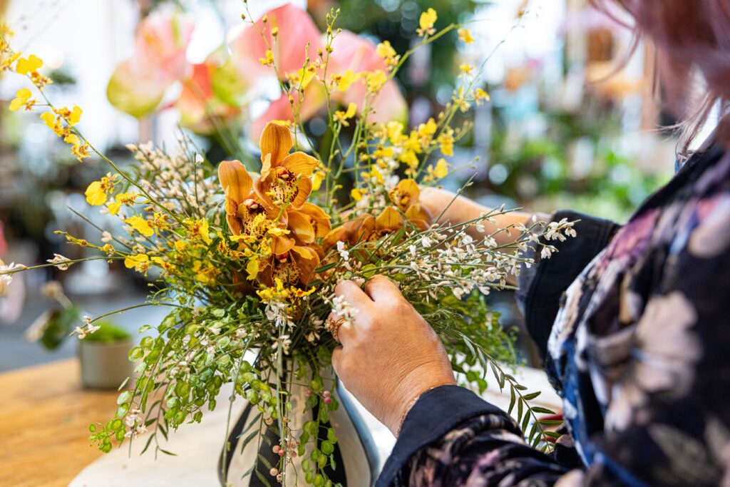 Stacy K Ercan arranges flowers at her business, Stacy K Floral in Rochester NY