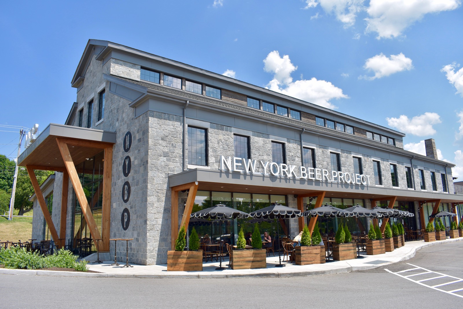 Daytime view of the stone building housing the New York Beer Project in Victor NY