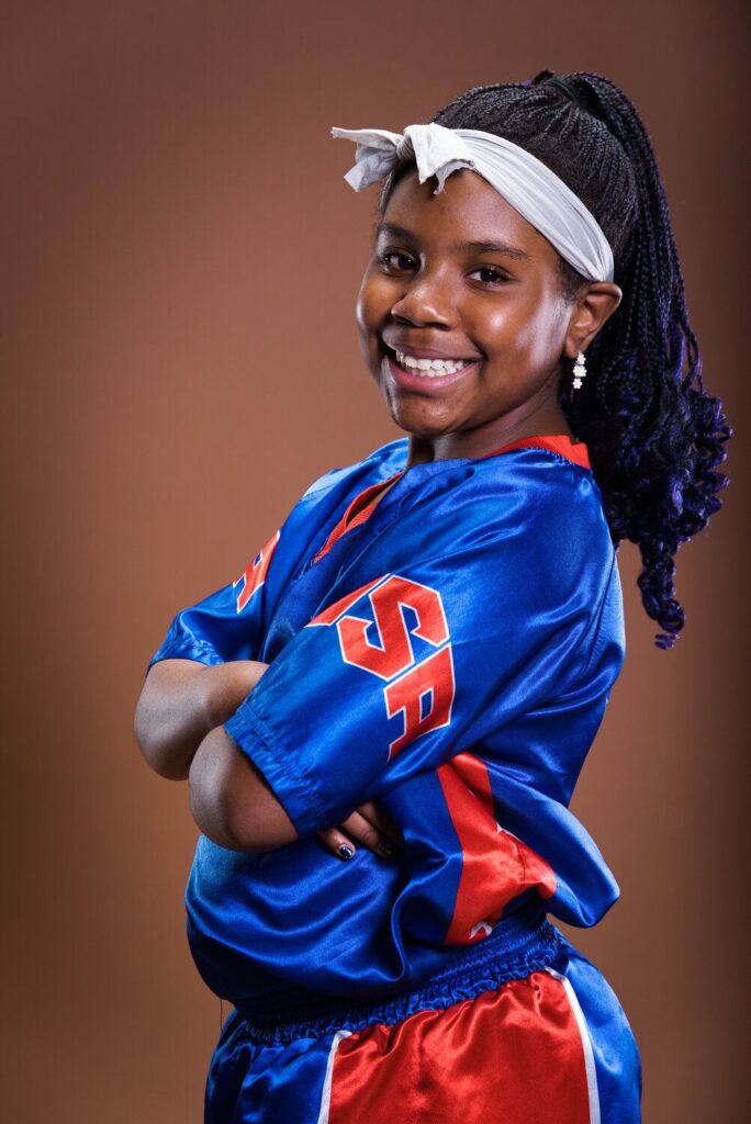 Krisdiana "Krissy" Dillard posing in karate uniform in Rochester, N.Y.