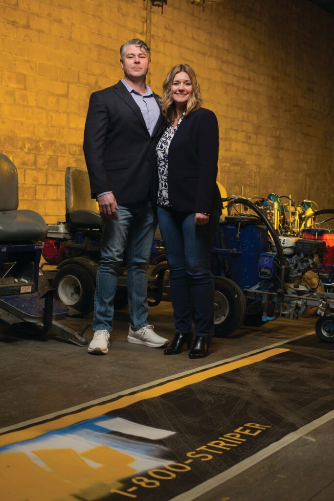 Owners of 1-800-STRIPER Luke and Heather Menear surrounding my equipment in Rochester, N.Y.