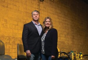 Owners of 1-800-STRIPER Luke and Heather Menear surrounding my equipment in Rochester, N.Y.