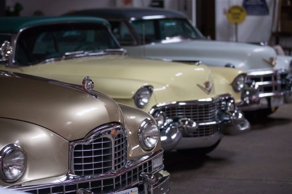 Three classic cars lined up in Central Park Garage in Rochester, N.Y.