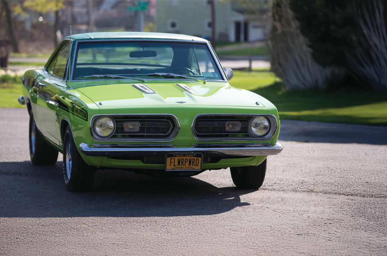 Roní McHugh's 1968 lime green Plymouth Barracuda parked in a driveway in Rochester, N.Y.