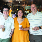 V Spehar, Christine Green, and Nick Koziol posing with coffees in hand at Cafe Sasso on Park Avenue in Rochester, N.Y.