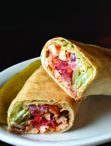 The ChickBasha pita wrap with grilled chicken, tomato, pickles, and garlic sauce at Basha Mediterranean Eatery in Rochester, N.Y.