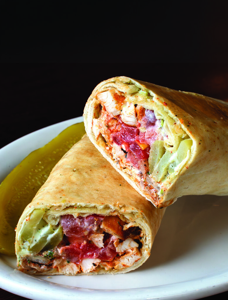 The ChickBasha pita wrap with grilled chicken, tomato, pickles, and garlic sauce at Basha Mediterranean Eatery in Rochester, N.Y.