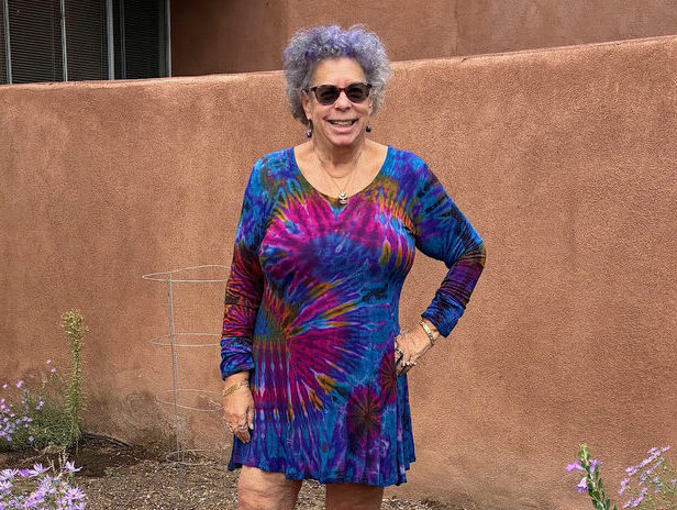 Ruth Thaler-Carter on her back patio among blooming asters Photo by Gail Thaler